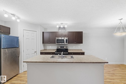 17365 8A Avenue, Edmonton, AB - Indoor Photo Showing Kitchen With Double Sink With Upgraded Kitchen
