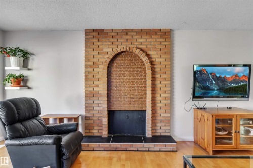 232 Ranchview Place Nw, Calgary, AB - Indoor Photo Showing Living Room With Fireplace