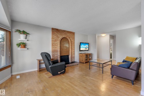 232 Ranchview Place Nw, Calgary, AB - Indoor Photo Showing Living Room With Fireplace