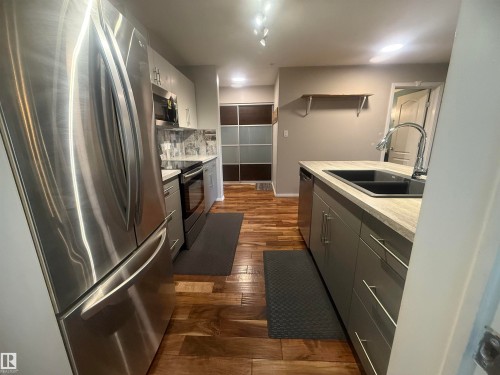 230 592 Hooke Road, Edmonton, AB - Indoor Photo Showing Kitchen With Double Sink
