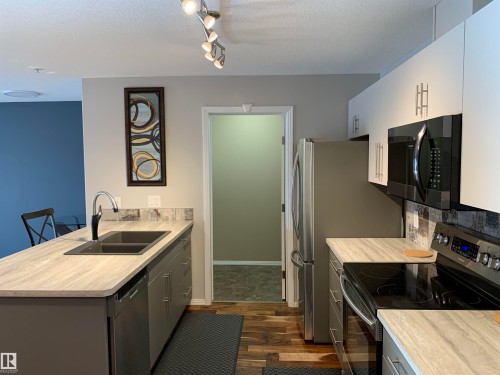 230 592 Hooke Road, Edmonton, AB - Indoor Photo Showing Kitchen With Double Sink