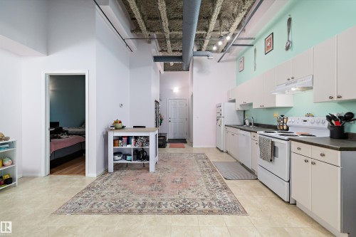 103 9817 103 Street, Fort Saskatchewan, AB - Indoor Photo Showing Kitchen With Double Sink