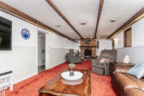 8412 71 Street, Edmonton, AB - Indoor Photo Showing Living Room With Fireplace