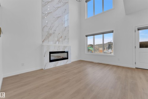 2 Cobblestone Gate, Spruce Grove, AB - Indoor Photo Showing Living Room With Fireplace