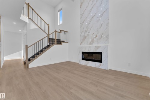 2 Cobblestone Gate, Spruce Grove, AB - Indoor Photo Showing Other Room With Fireplace