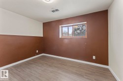 Unfurnished room with wood finished floors - 