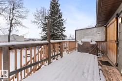 Snow covered deck featuring a grill - 