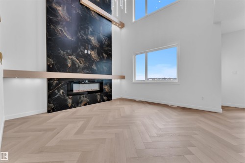 404 Pine Point(E), Leduc, AB - Indoor Photo Showing Other Room With Fireplace