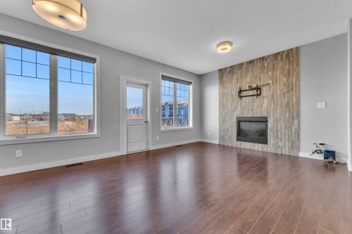 6664 Cardinal Road, Edmonton, AB - Indoor Photo Showing Living Room With Fireplace