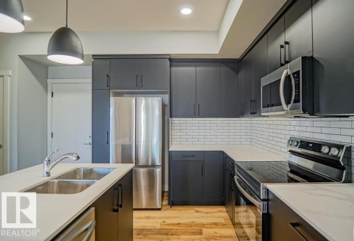 75 Greenfield Link, Fort Saskatchewan, AB - Indoor Photo Showing Kitchen With Stainless Steel Kitchen With Double Sink With Upgraded Kitchen