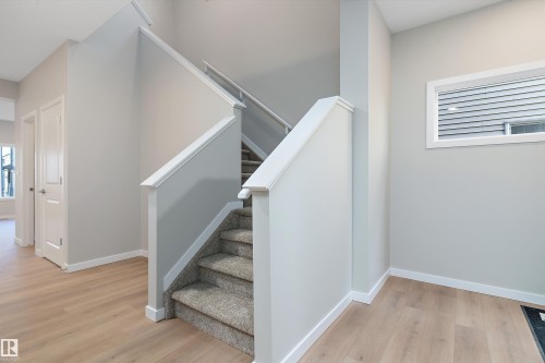 Stairs with wood finished floors - 6320 King Wynd, Edmonton, AB - Indoor Photo Showing Other Room