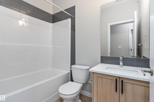 Full bath with vanity and shower / washtub combination - 6320 King Wynd, Edmonton, AB - Indoor Photo Showing Bathroom