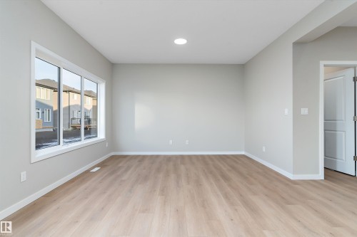 Spare room featuring light wood-style floors and recessed lighting - 6320 King Wynd, Edmonton, AB - Indoor Photo Showing Other Room