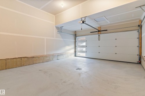 Garage with a garage door opener - 6320 King Wynd, Edmonton, AB - Indoor Photo Showing Garage