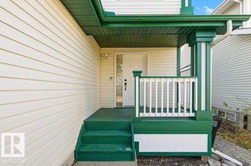 View of exterior entry with covered porch - 1112 118A Street Nw, Edmonton, AB - Outdoor With Exterior