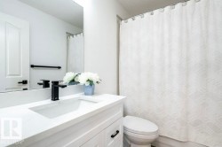 Bathroom featuring vanity and a textured ceiling - 