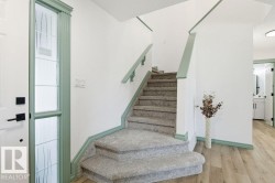 Staircase featuring wood finished floors and baseboards - 
