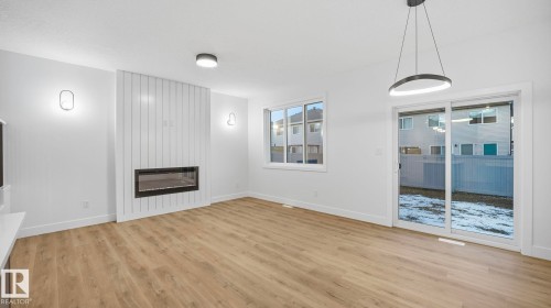 110 Spring Link, Spruce Grove, AB - Indoor Photo Showing Other Room With Fireplace