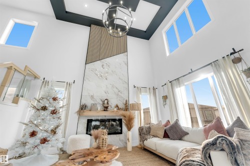 3822 42 Avenue, Beaumont, AB - Indoor Photo Showing Living Room With Fireplace