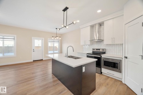 374 Bluff Cove, Leduc, AB - Indoor Photo Showing Kitchen With Double Sink With Upgraded Kitchen