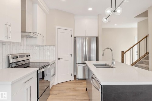 374 Bluff Cove, Leduc, AB - Indoor Photo Showing Kitchen With Double Sink With Upgraded Kitchen