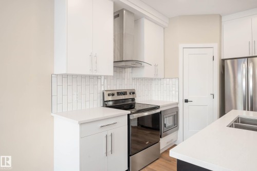 374 Bluff Cove, Leduc, AB - Indoor Photo Showing Kitchen With Double Sink With Upgraded Kitchen