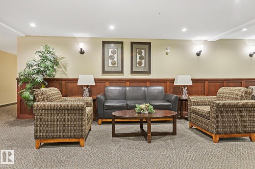 110 1589 Glastonbury Boulevard, Edmonton, AB - Indoor Photo Showing Living Room