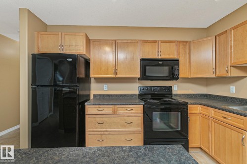 110 1589 Glastonbury Boulevard, Edmonton, AB - Indoor Photo Showing Kitchen