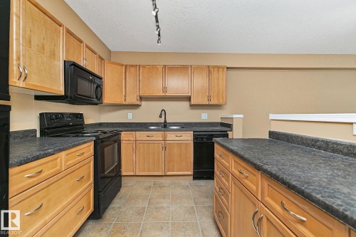 110 1589 Glastonbury Boulevard, Edmonton, AB - Indoor Photo Showing Kitchen