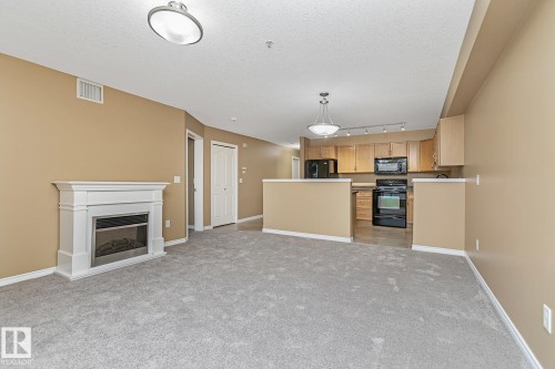 110 1589 Glastonbury Boulevard, Edmonton, AB - Indoor With Fireplace