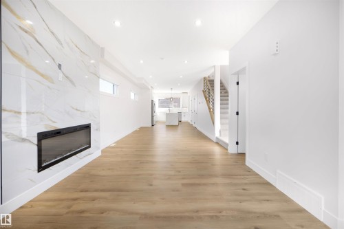 10711 52 Street, Edmonton, AB - Indoor Photo Showing Other Room With Fireplace
