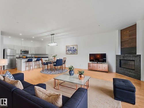 105 11415 100 Avenue, Edmonton, AB - Indoor Photo Showing Living Room With Fireplace