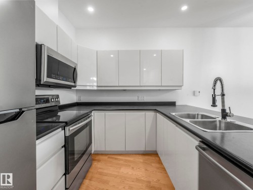105 11415 100 Avenue, Edmonton, AB - Indoor Photo Showing Kitchen With Stainless Steel Kitchen With Double Sink