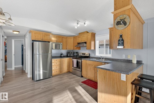 1160 Aspen Drive W, Leduc, AB - Indoor Photo Showing Kitchen With Stainless Steel Kitchen With Double Sink