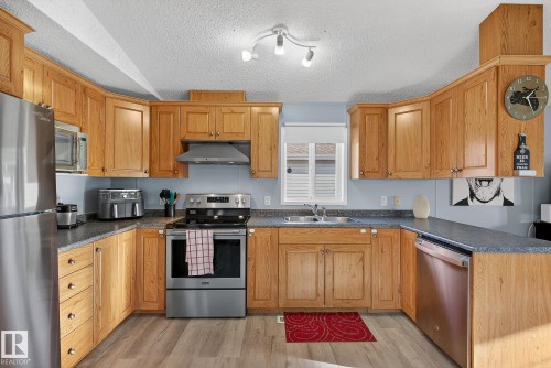 1160 Aspen Drive W, Leduc, AB - Indoor Photo Showing Kitchen With Stainless Steel Kitchen With Double Sink