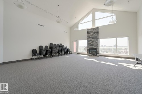501 9708 110 Street, Edmonton, AB - Indoor Photo Showing Other Room With Fireplace