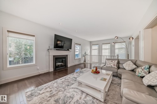 3503 Goodridge Bay Nw, Edmonton, AB - Indoor Photo Showing Living Room With Fireplace