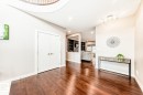 Foyer entrance featuring baseboards and wood finished floors - 10 Legacy Terrace, St. Albert, AB  - Indoor Photo Showing Other Room 