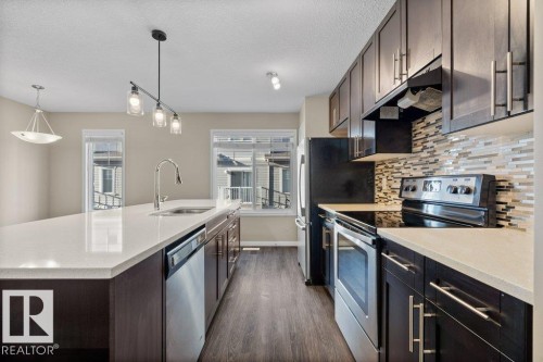 24 4850 Terwillegar Common, Edmonton, AB - Indoor Photo Showing Kitchen With Stainless Steel Kitchen With Upgraded Kitchen