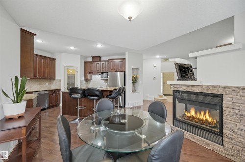 3411 Macneil Link, Edmonton, AB - Indoor Photo Showing Dining Room With Fireplace