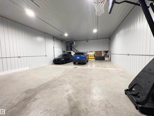 Garage featuring metal wall - 5510 Railway Avenue, Glendon, AB - Indoor Photo Showing Garage