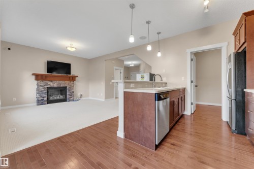 3650 13 Street, Edmonton, AB - Indoor Photo Showing Kitchen With Fireplace