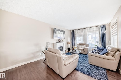 1717 Hammond Crescent Nw, Edmonton, AB - Indoor Photo Showing Living Room With Fireplace