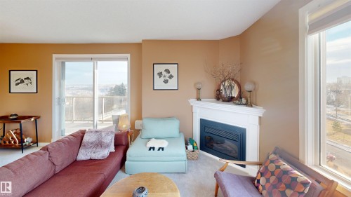 605 10649 Saskatchewan Drive, Edmonton, AB - Indoor Photo Showing Living Room With Fireplace