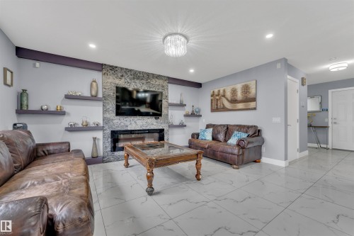 3212 29 Avenue, Edmonton, AB - Indoor Photo Showing Living Room With Fireplace