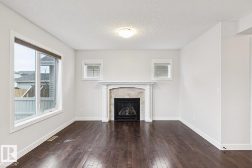 323 Avena Link, Leduc, AB - Indoor Photo Showing Living Room With Fireplace