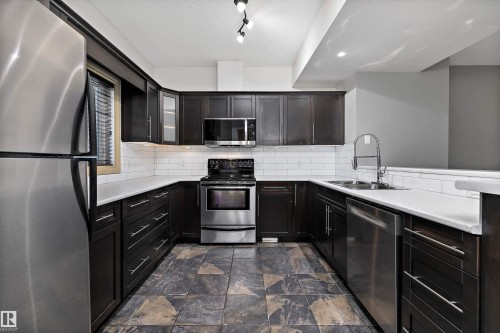 17 903 Rutherford Road, Edmonton, AB - Indoor Photo Showing Kitchen With Stainless Steel Kitchen With Double Sink With Upgraded Kitchen