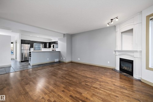 17 903 Rutherford Road, Edmonton, AB - Indoor Photo Showing Living Room With Fireplace