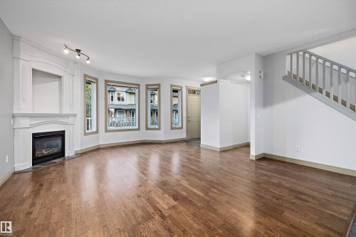 17 903 Rutherford Road, Edmonton, AB - Indoor Photo Showing Living Room With Fireplace