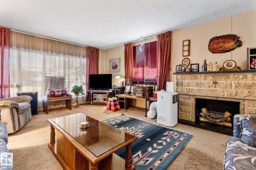 44 305 Calahoo Road, Spruce Grove, AB - Indoor Photo Showing Living Room With Fireplace